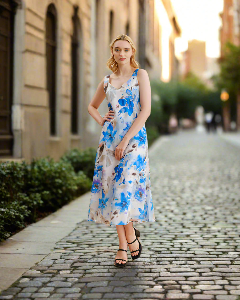 Woman wearing a floral dress against a beige background