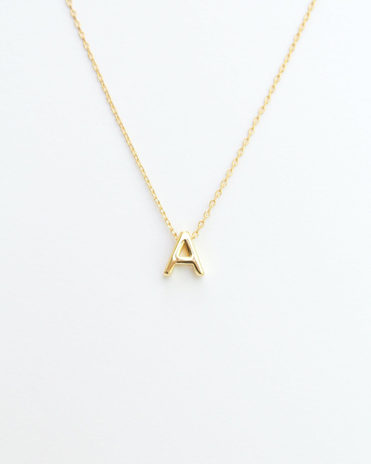 Gold initial necklace from The KADOU Jewelry Edit