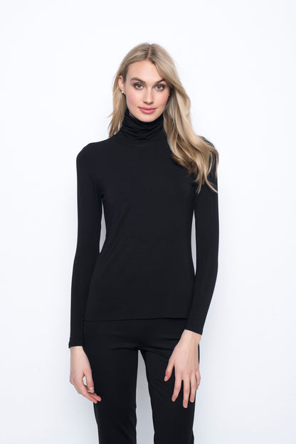 The model is wearing the Long Sleeve Turtleneck Top in black color.