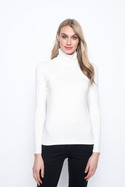 Long Sleeve Turtleneck Top in off white color. Available at Kadou Boutique.