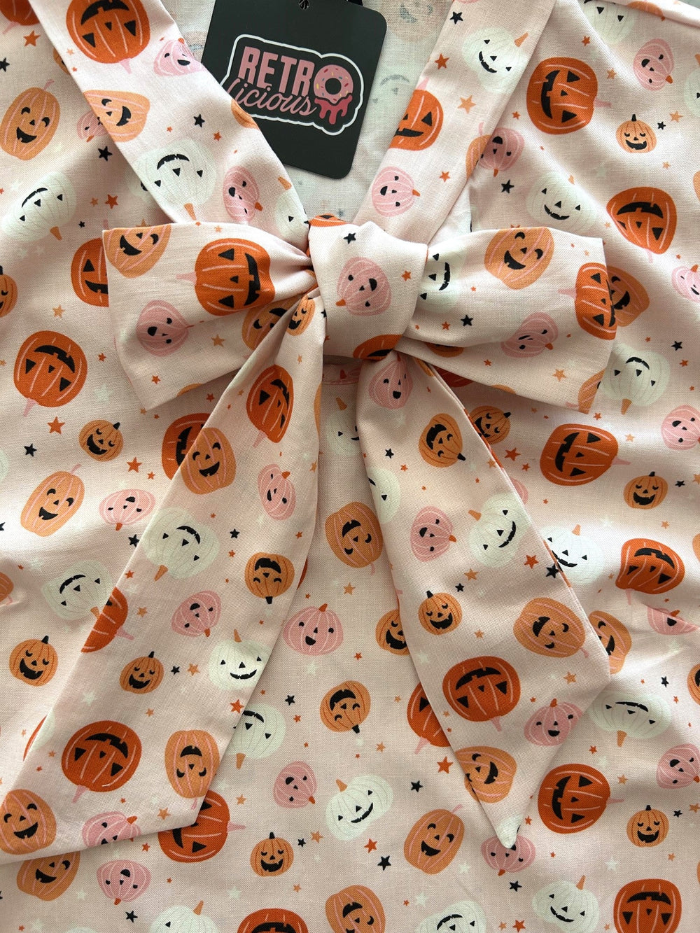 Pink Jack-O’-Lantern Bow Top from KADOU Boutique
