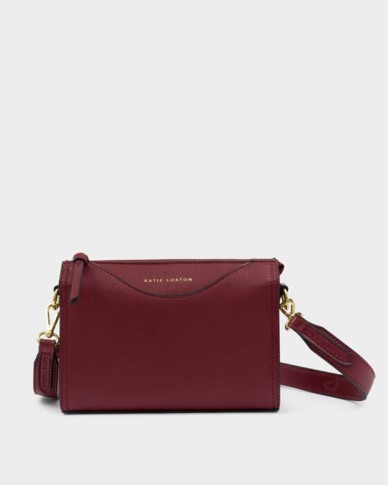 Maroon handbag with gold accents on a white background