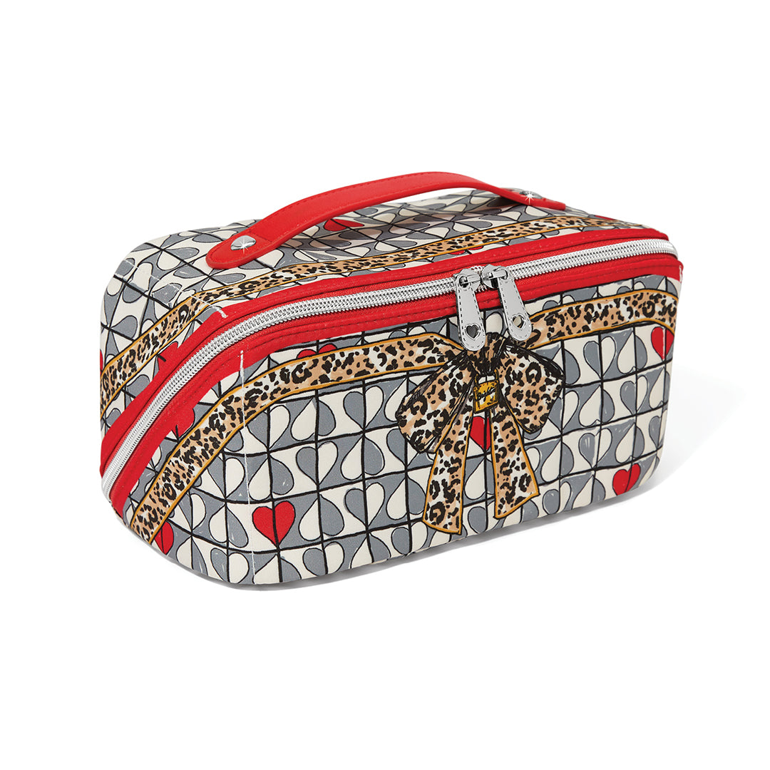 Patterned makeup bag with red accents on a white background