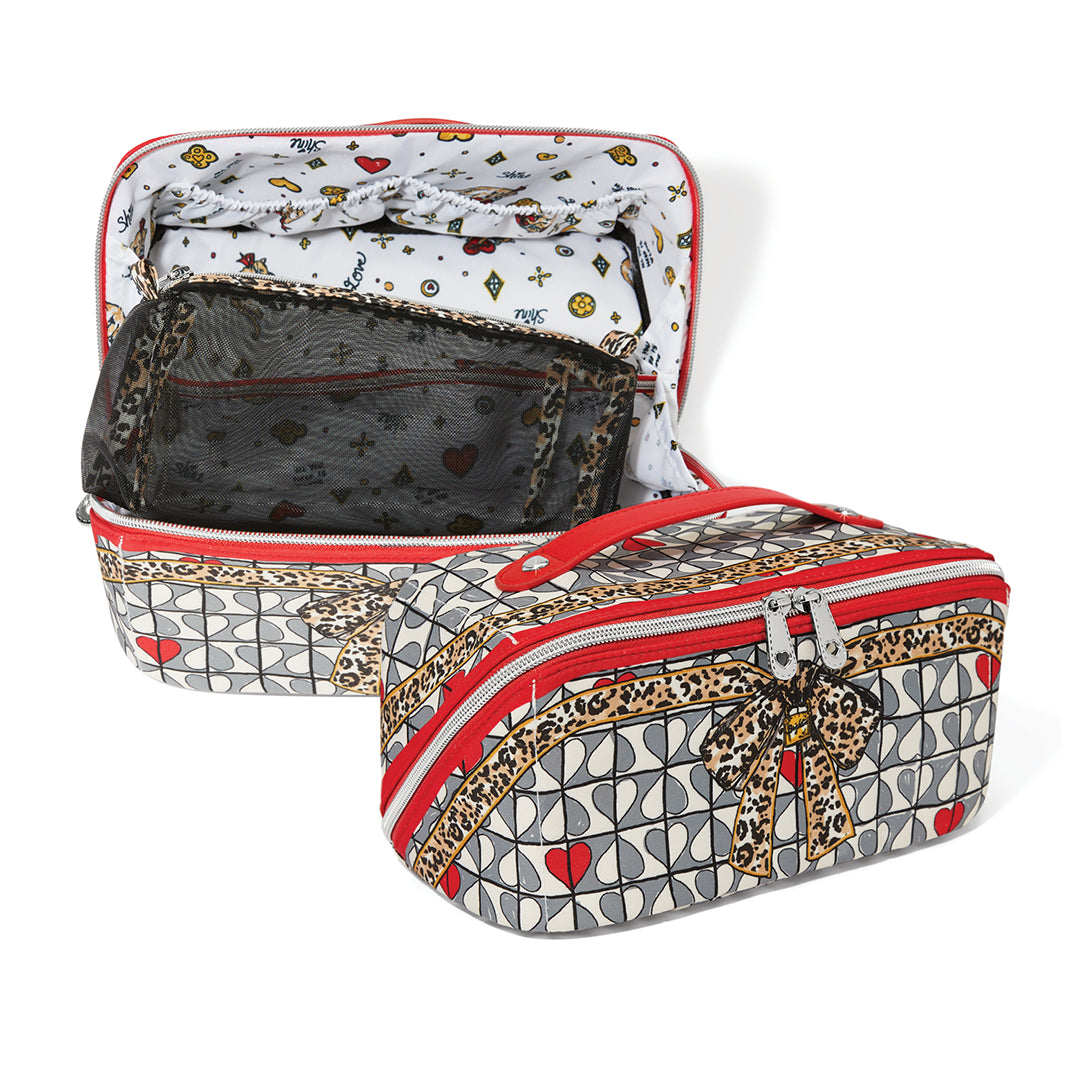 Patterned makeup bag with open top section on a white background