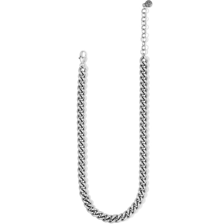 Showing the silver chain necklace with its adjustable extension on a white background 