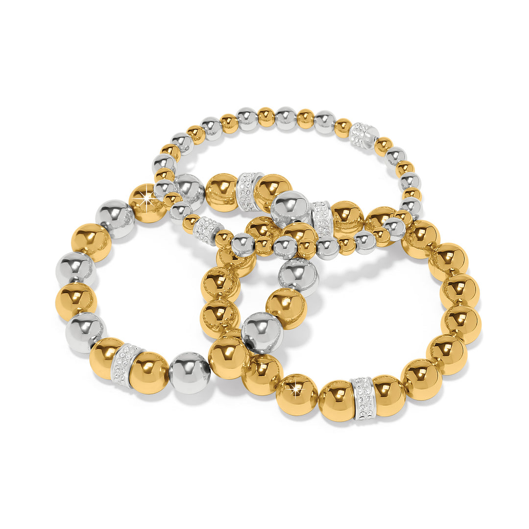 Three gold and silver beaded bracelets on a white background