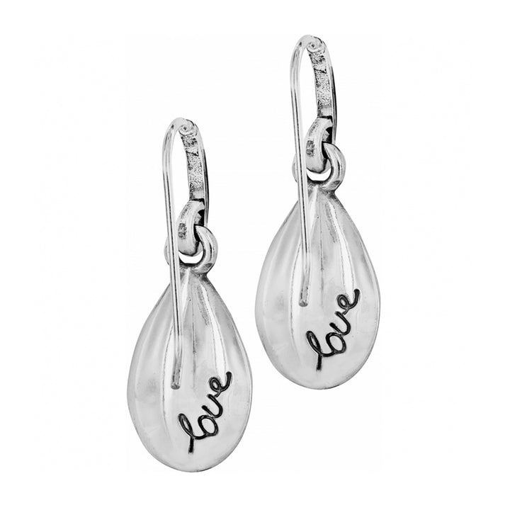 a back view of the silver teardrop earrings with 'love' engraving on a white background