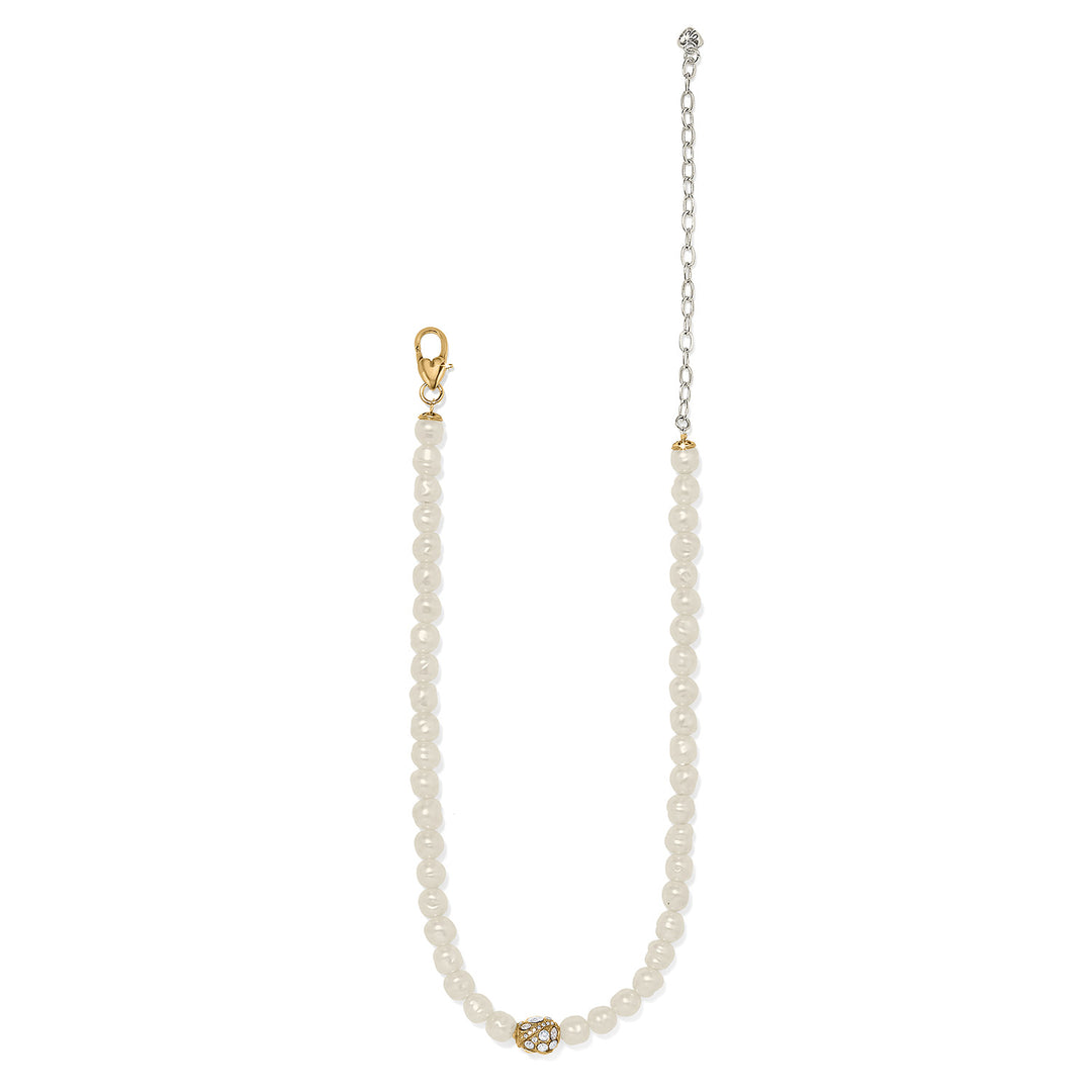 Pearl necklace with gold clasp and adjustable chain on a white background