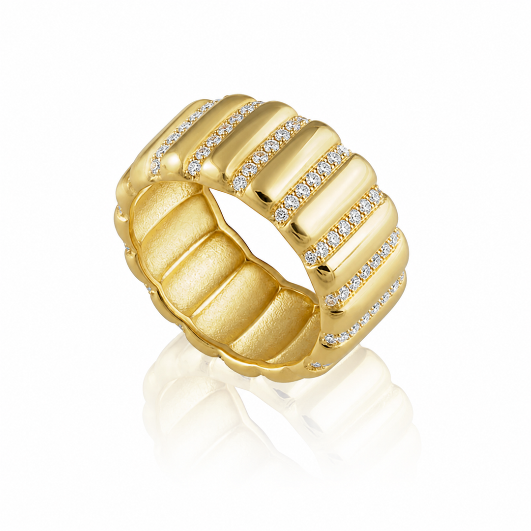 Gold ring with diamond accents on a white background