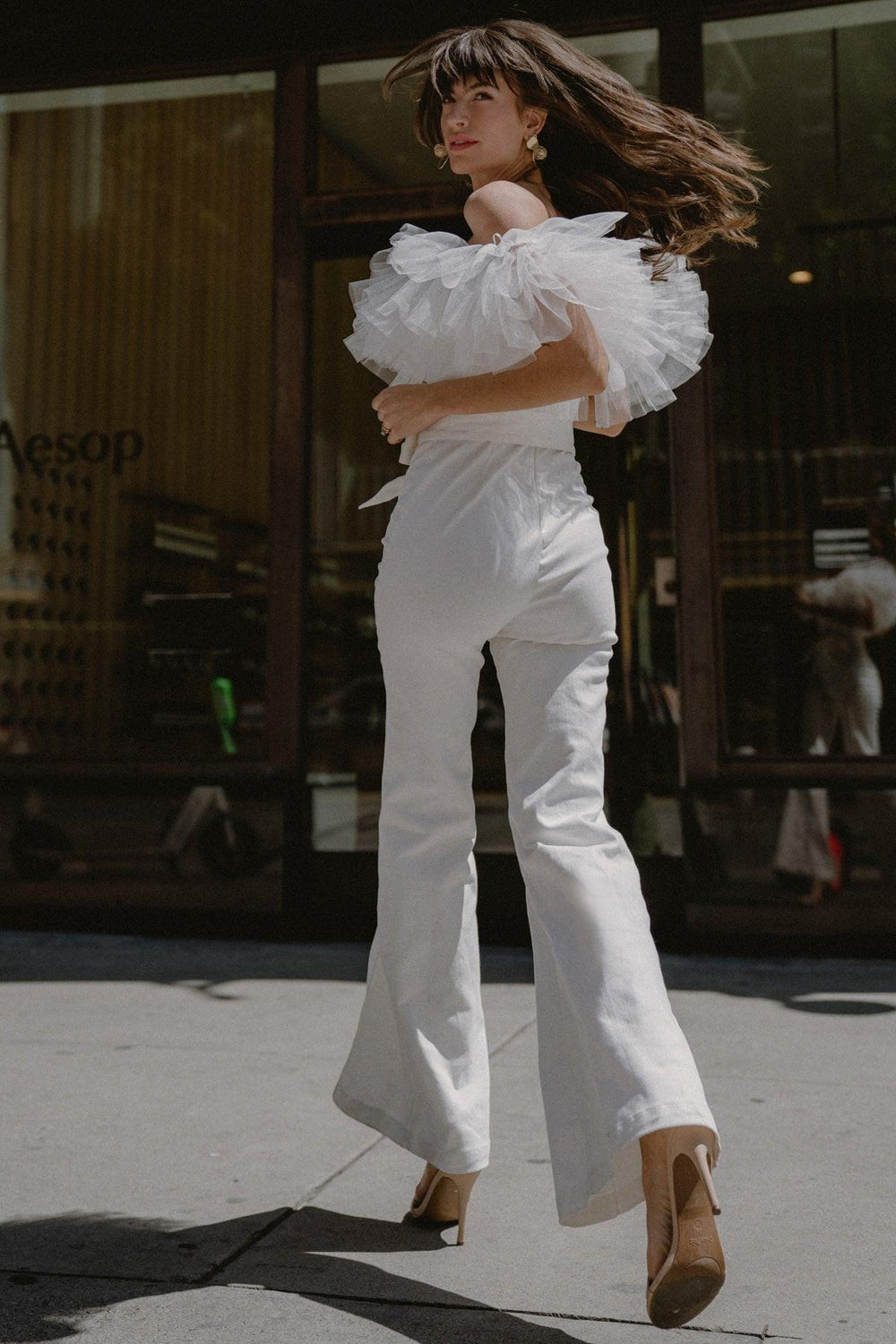 A Power Mood White Denim Jumpsuit from KADOU Boutique