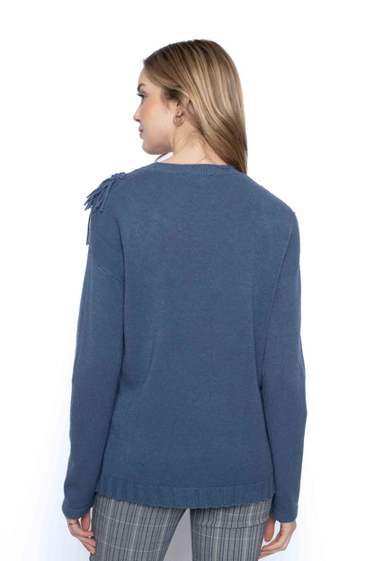The Decorated Neckline Sweater, a back view.
