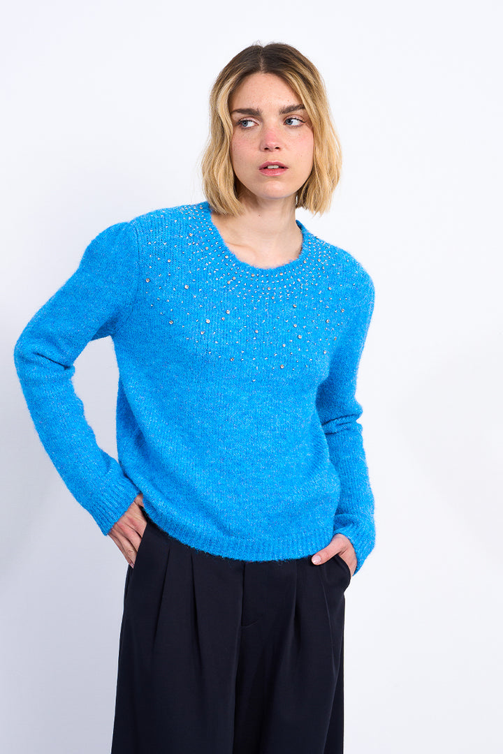 Person wearing a blue sweater on a white background