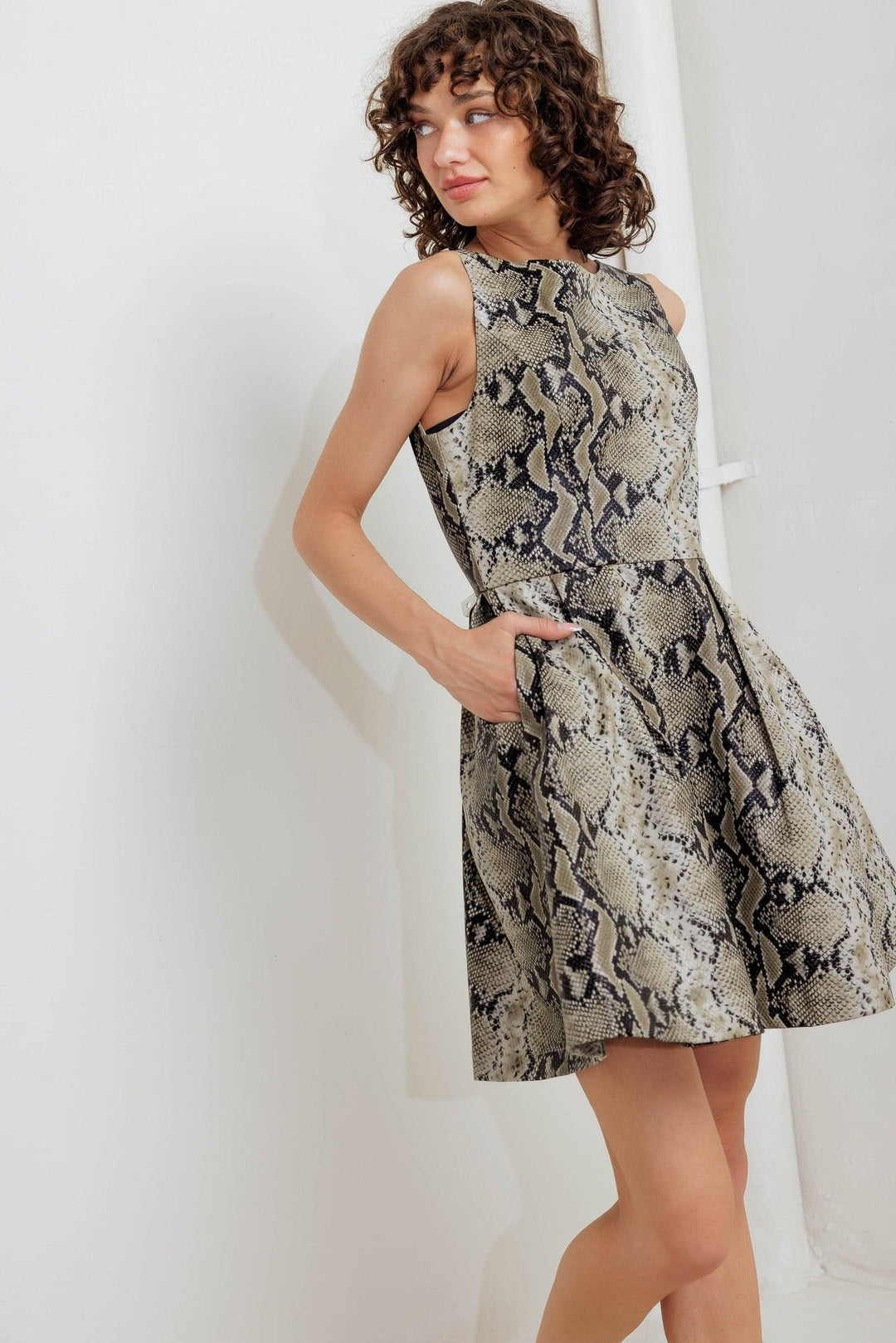 Snake Glam Faux Leather Mini Dress from KADOU Boutique