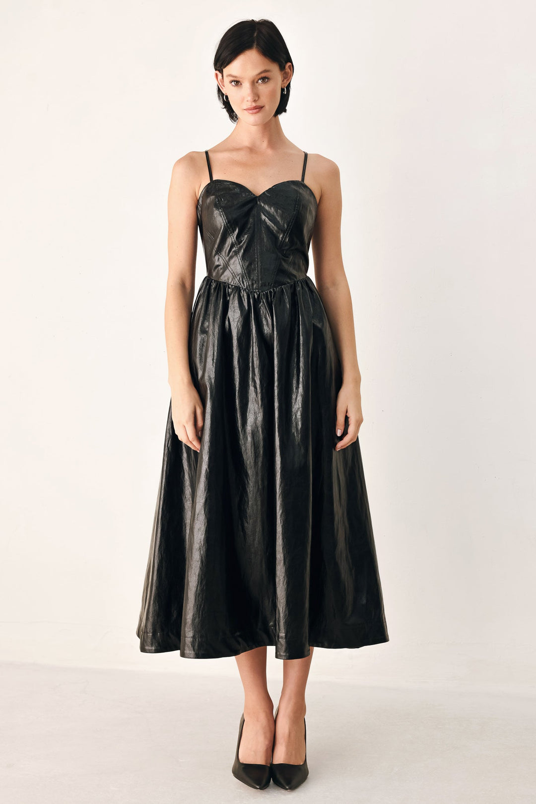 Dressed to Thrill Faux Leather Midi Dress from KADOU Boutique