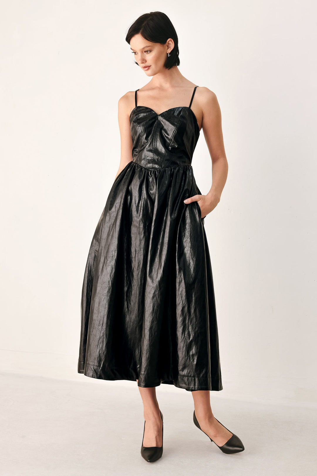Dressed to Thrill Faux Leather Midi Dress from KADOU Boutique