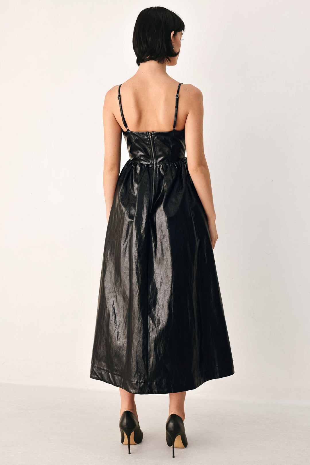 Dressed to Thrill Faux Leather Midi Dress from KADOU Boutique
