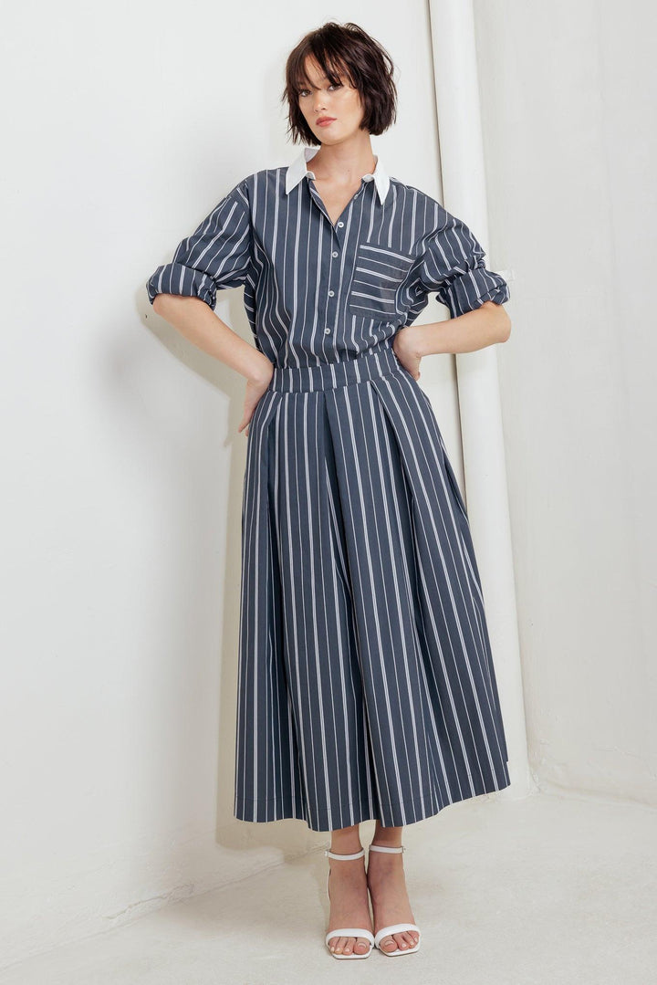 Behind the Grin Woven Midi Skirt from KADOU Boutique