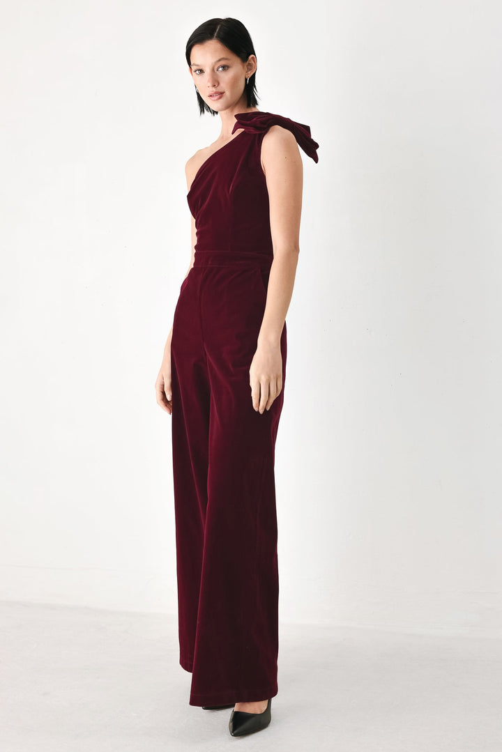Berry After Dark Velvet Bow One-Shoulder Jumpsuit from KADOU Boutique