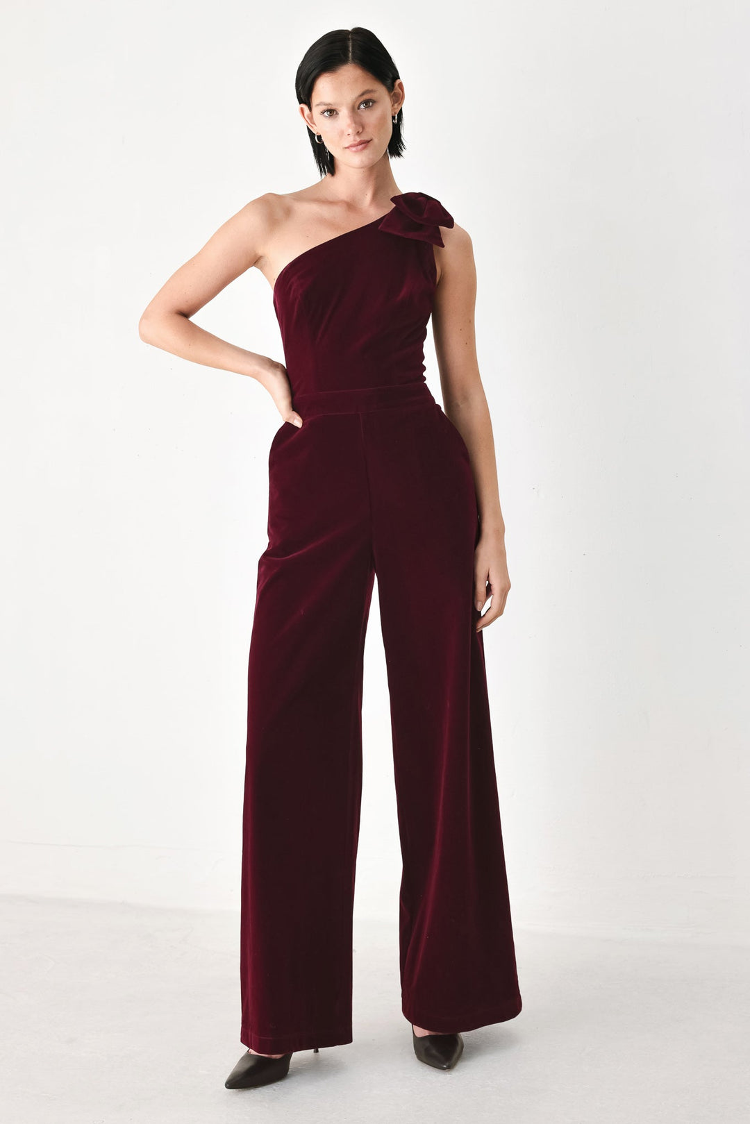 Berry After Dark Velvet Bow One-Shoulder Jumpsuit from KADOU Boutique