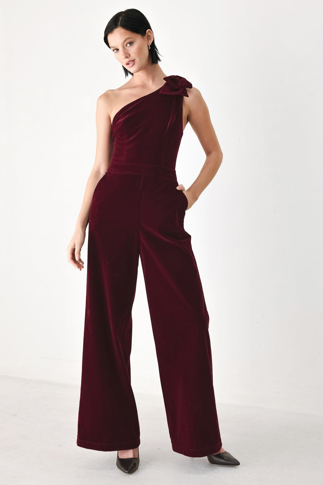 Berry After Dark Velvet Bow One-Shoulder Jumpsuit from KADOU Boutique