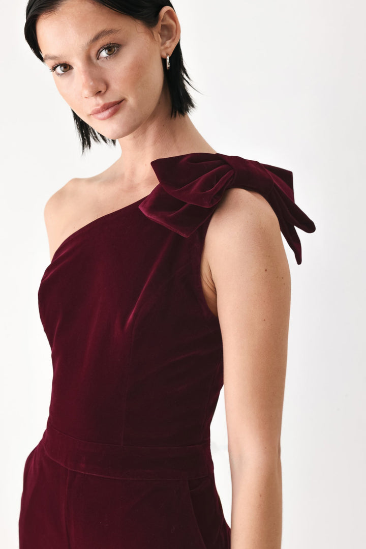 Berry After Dark Velvet Bow One-Shoulder Jumpsuit from KADOU Boutique