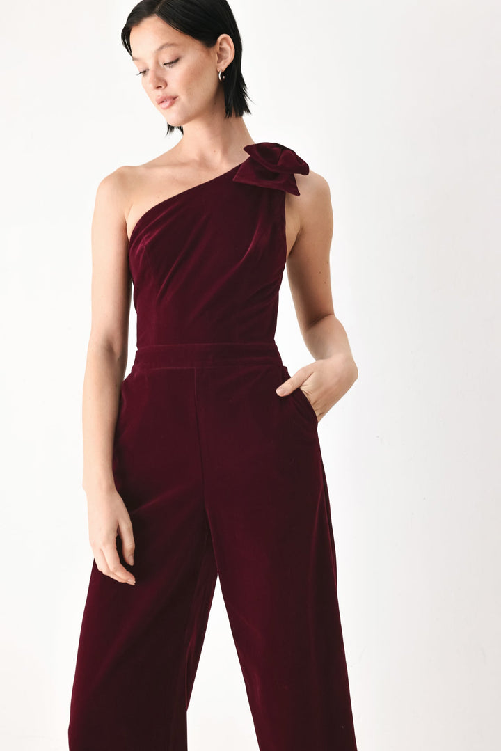 Berry After Dark Velvet Bow One-Shoulder Jumpsuit from KADOU Boutique