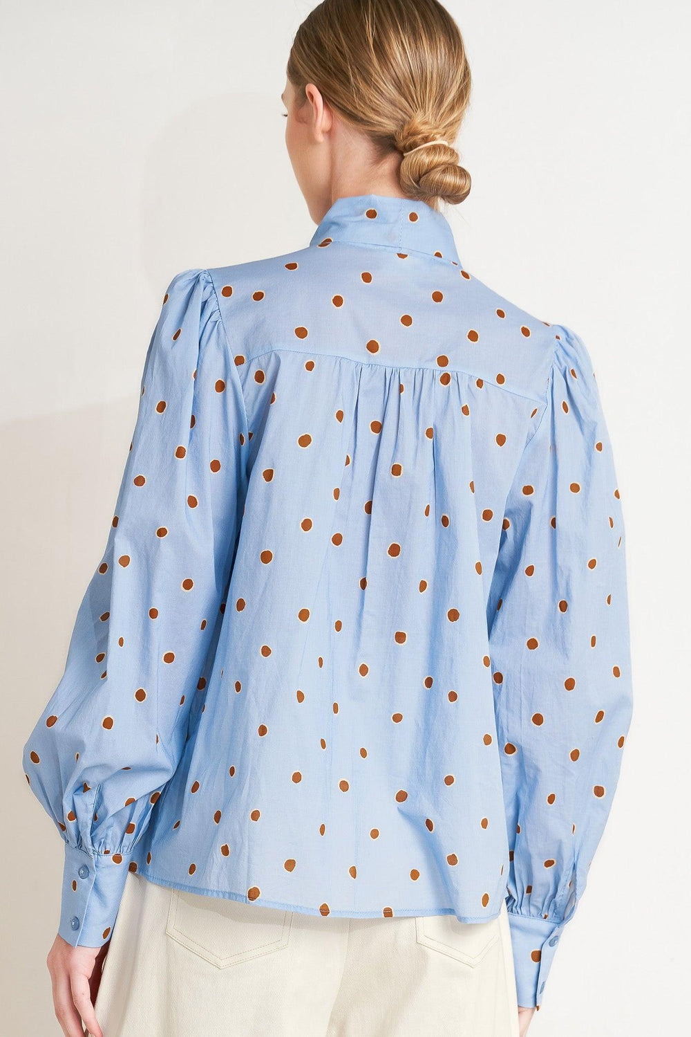 The Polka Power Move Woven Top from KADOU Boutique