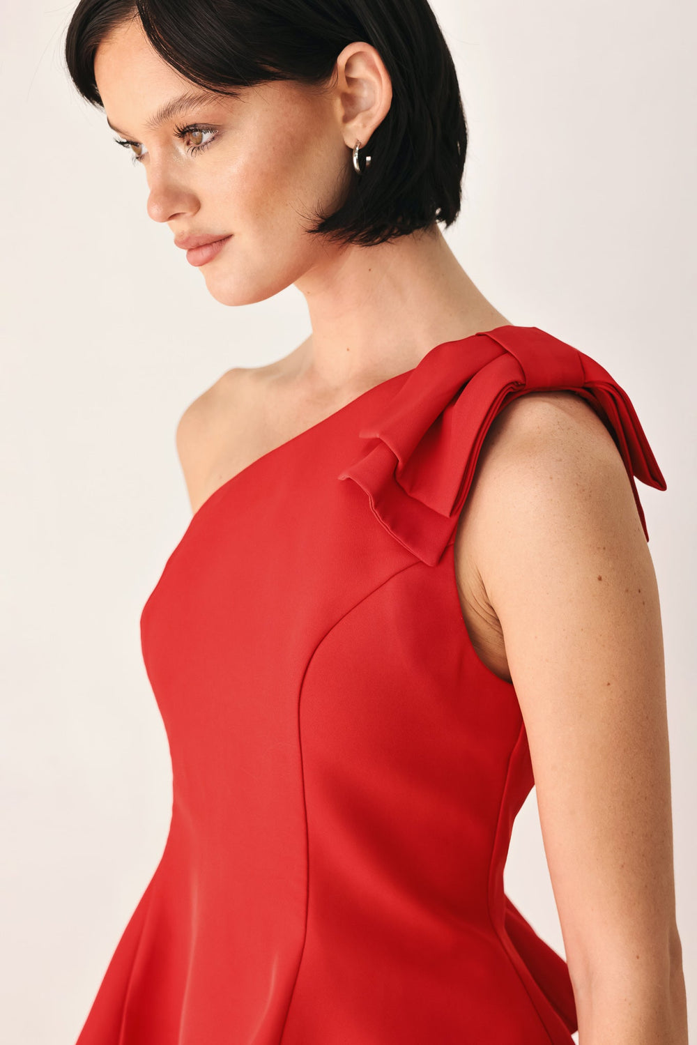Make an Entrance One Shoulder Peplum Top from KADOU Boutique