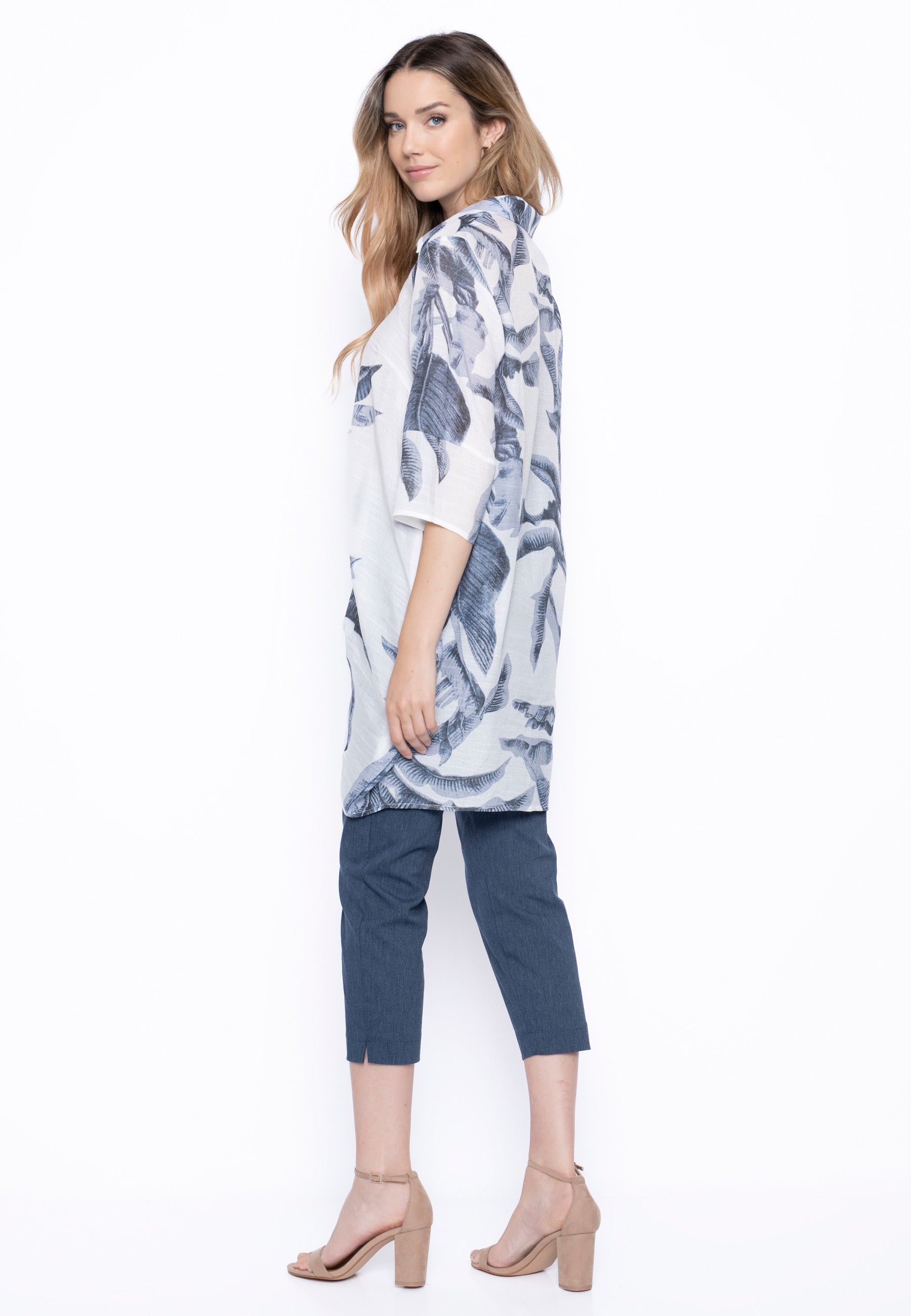 The model is wearing the Donna Long Shirt with denim-colored pants.