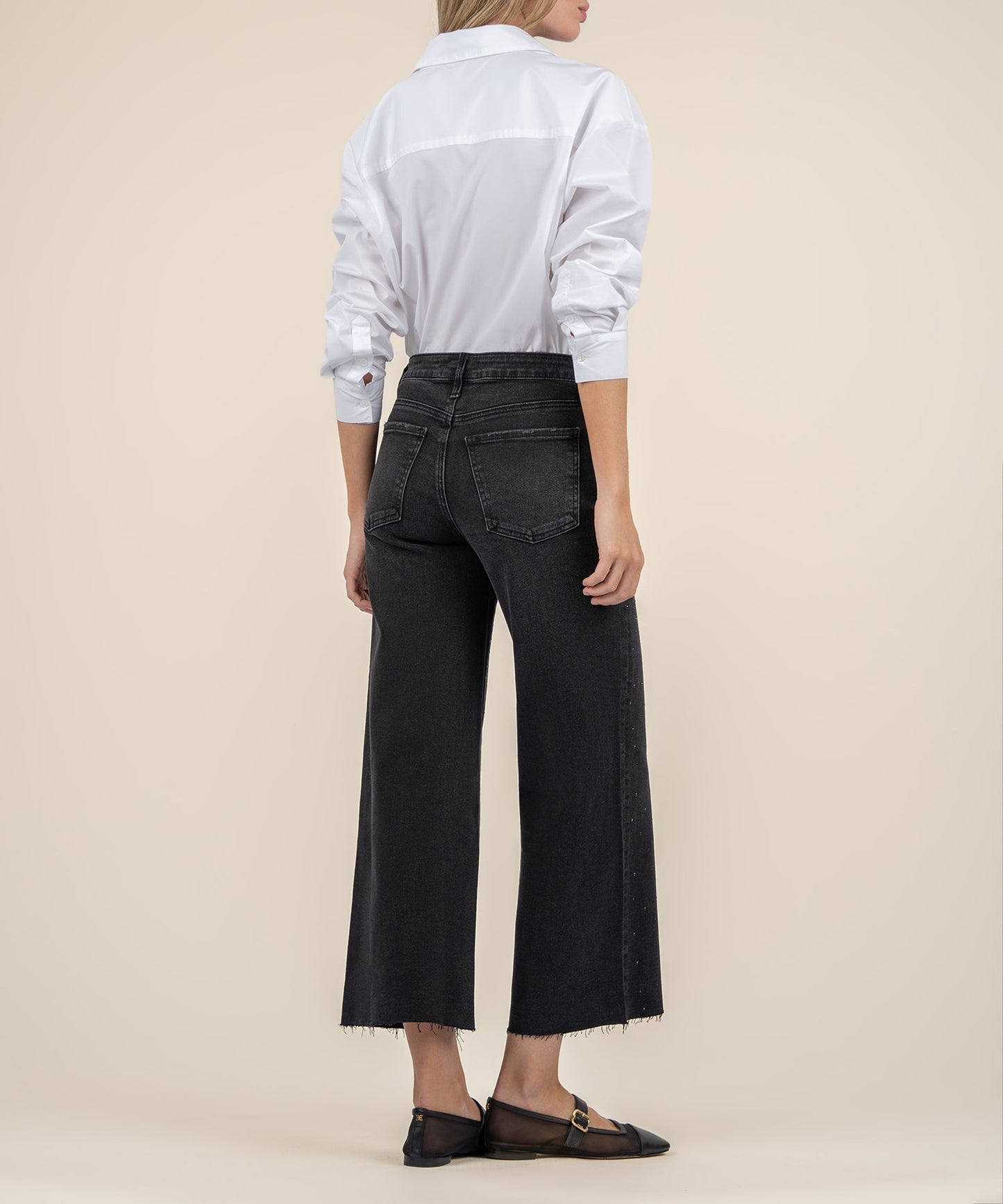 Illuminated Wide Leg Raw Hem Denim Pants in black color, a back view.