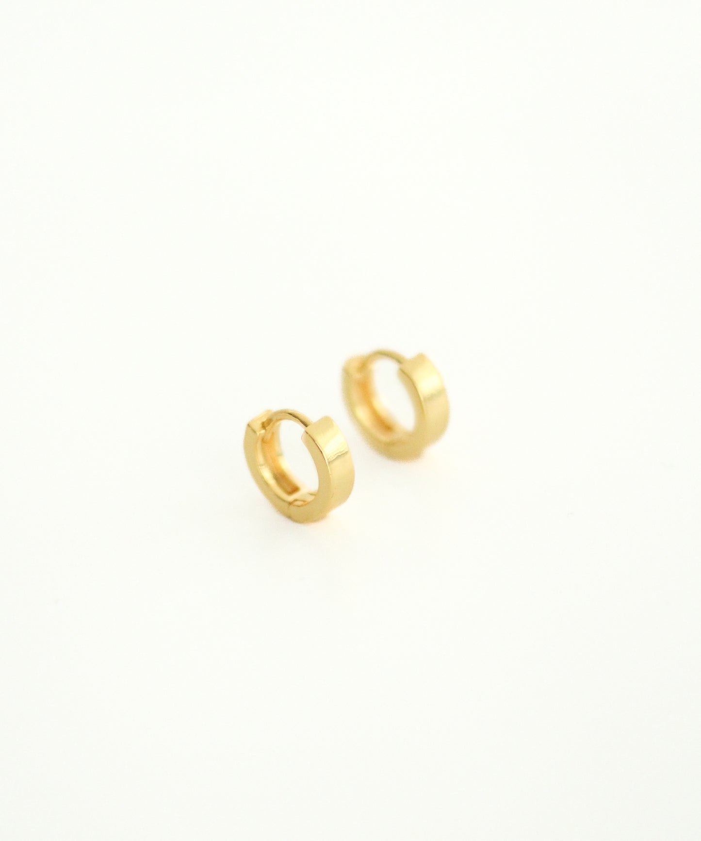 Small Flat Hoop Gold Huggie Earrings.