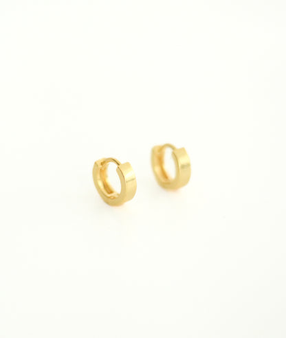 Small Flat Hoop Gold Huggie Earrings. Well wrapped and packaged to arrive to our customer  in a perfect condition.