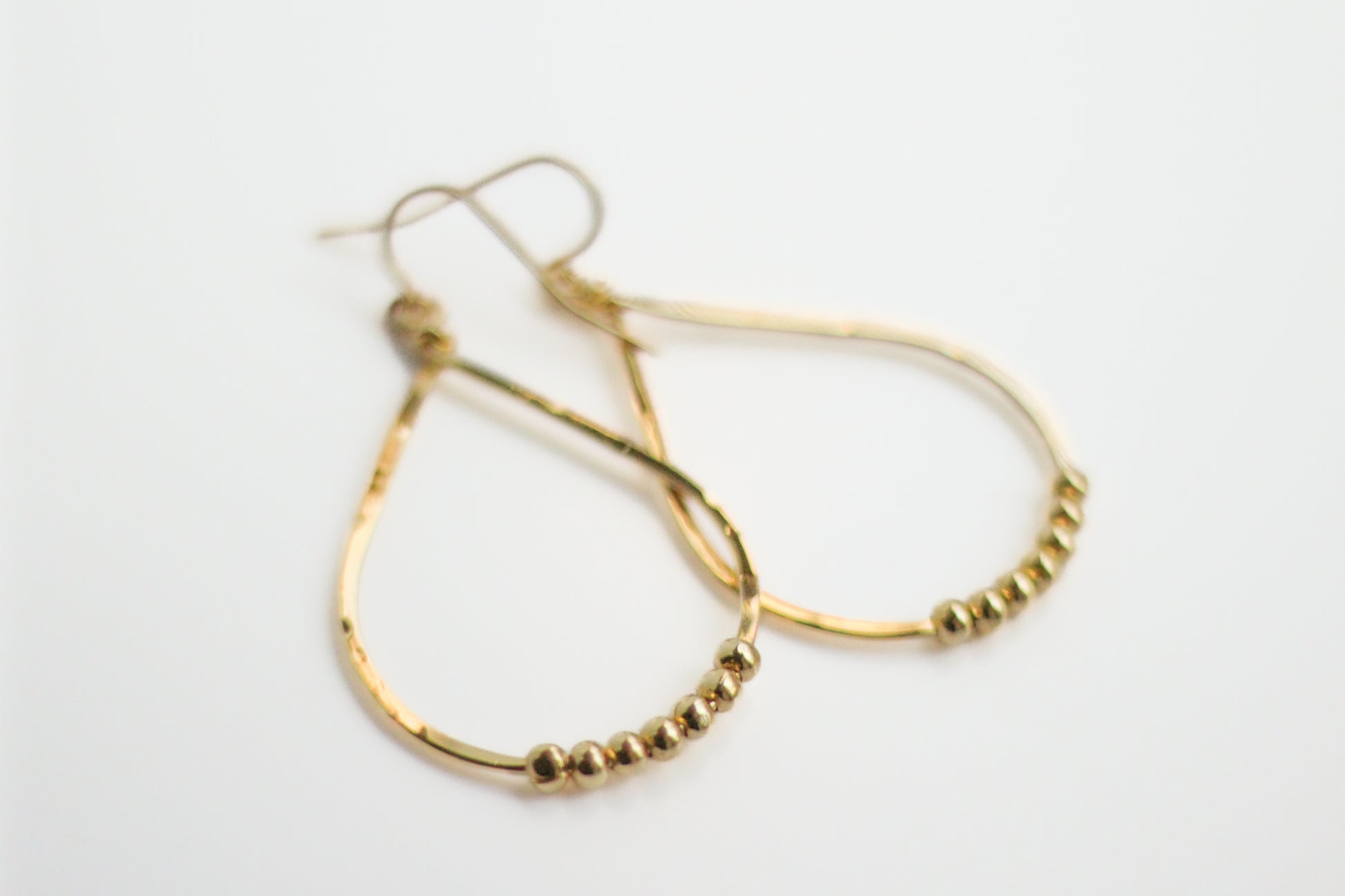 Hammered Teardrop Beads Earrings at Kadou Boutique.