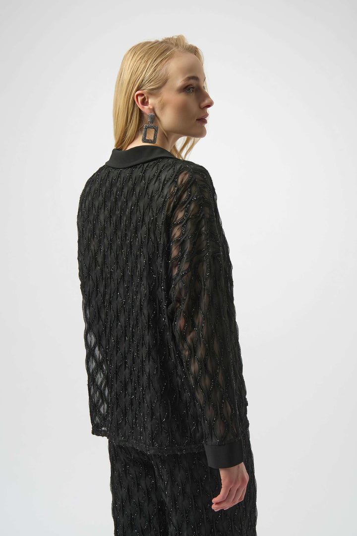 Person wearing a black textured outfit on a white background