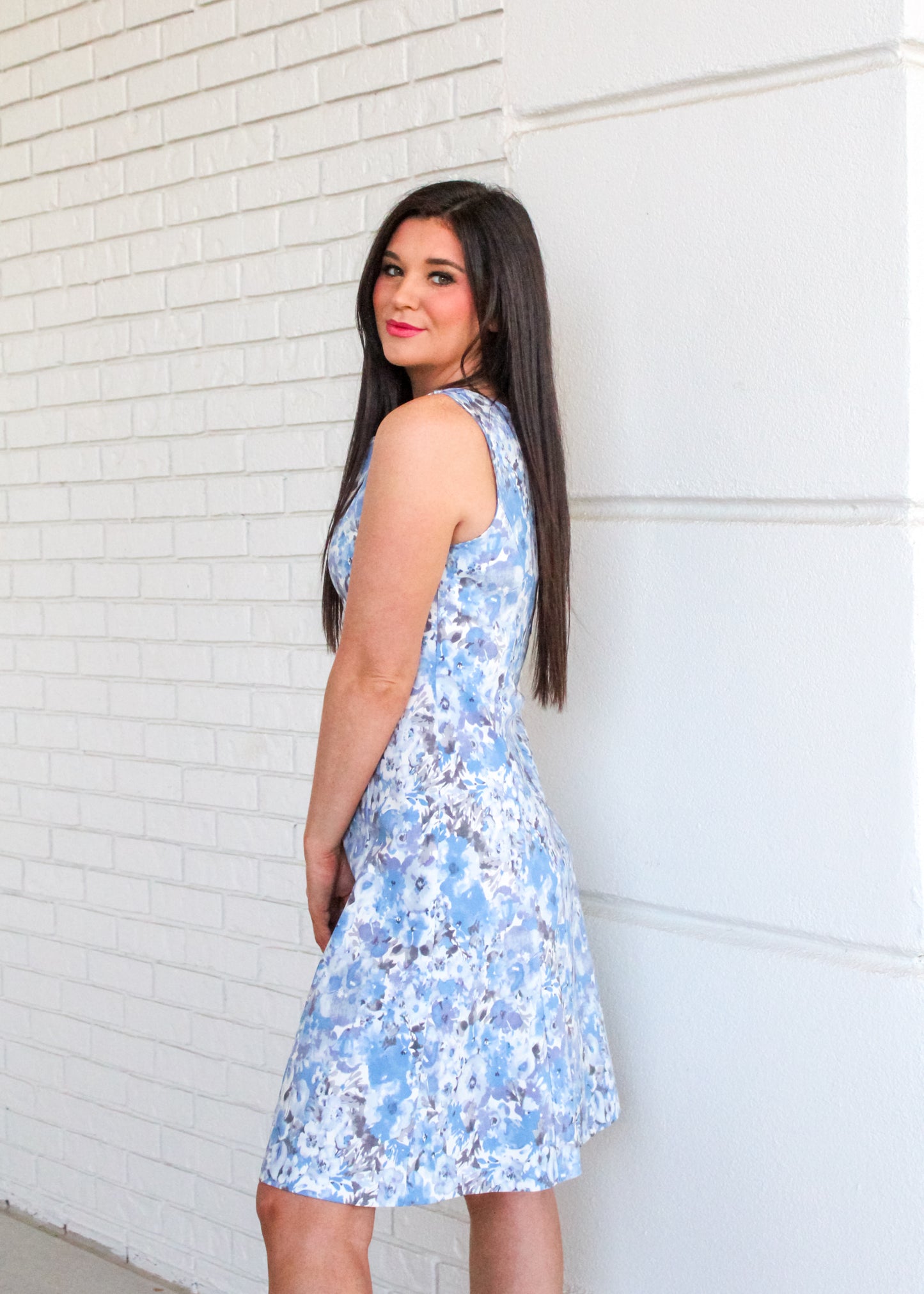 A side view of The Maggie Sleeveless Dress.