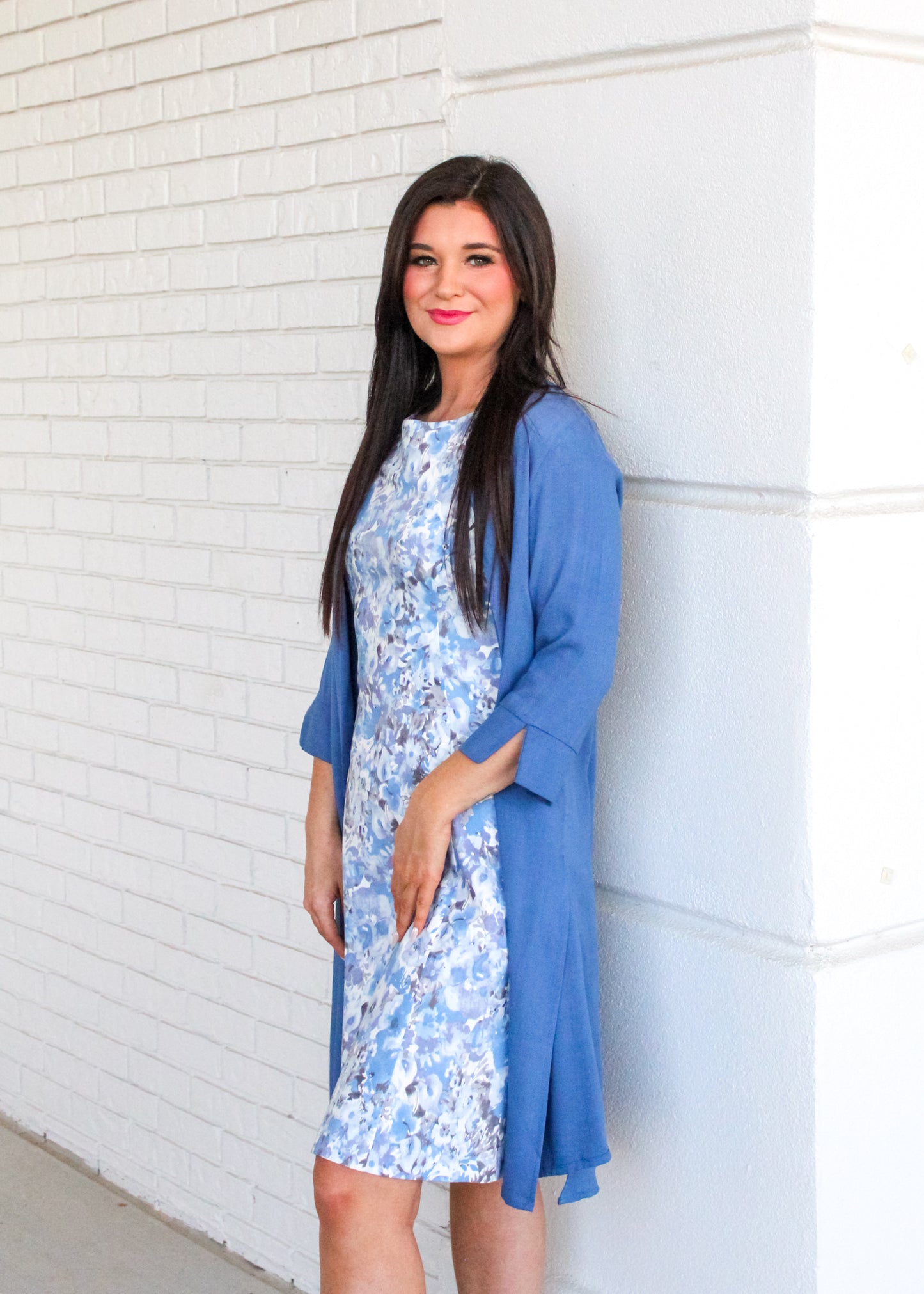 The model is showing the Maggie Sleeveless Dress with the 3/4 Sleeve Long Cardigan in Blue.