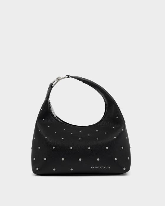 Black handbag with silver-colored studs on a light gray background