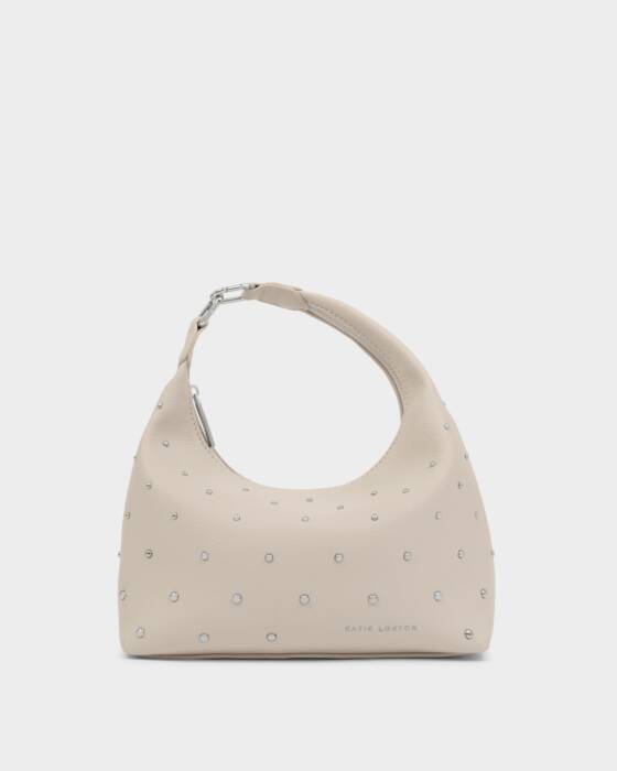 Light gray handbag with stud details on a light gray background