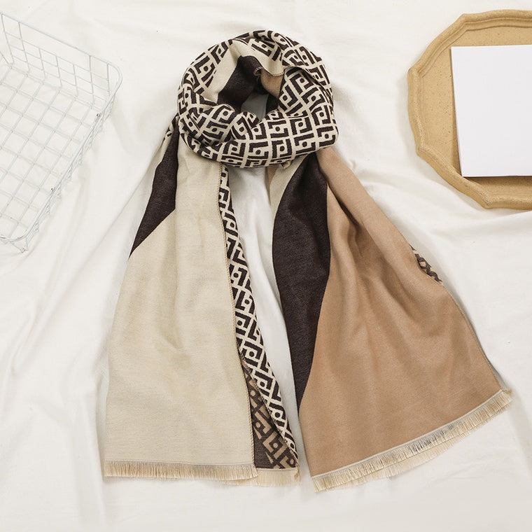 Scarf with geometric pattern draped over a surface