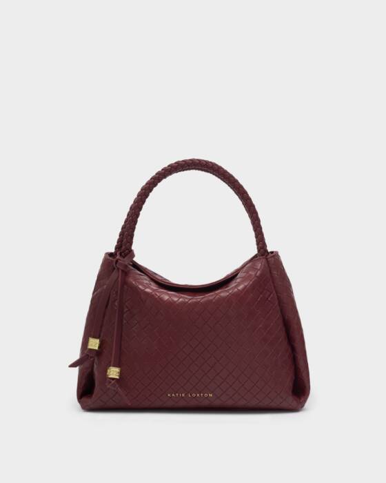 Maroon handbag with gold accents on a light gray background