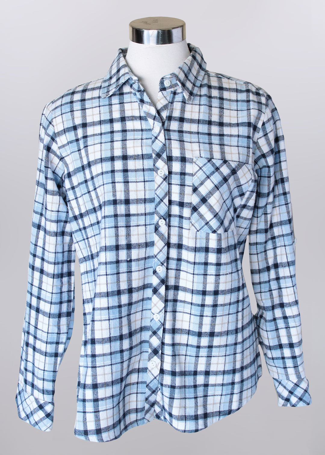 Blue and white plaid button-up shirt with patch pocket on a mannequin against a gray background