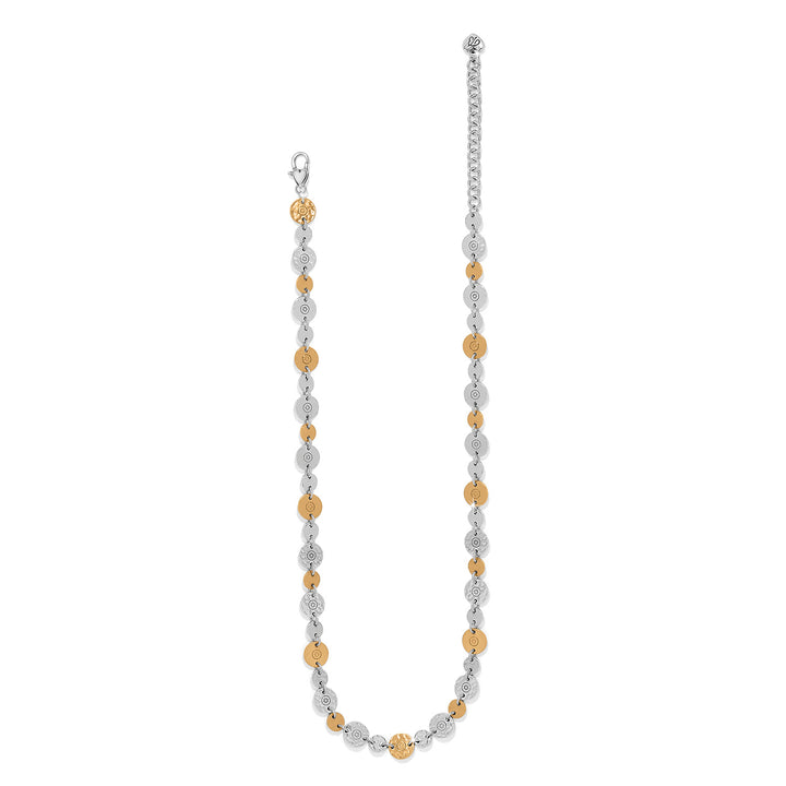 Necklace with alternating silver and gold beads on a white background