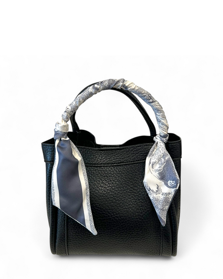 Black handbag with silver decorative elements on a white background