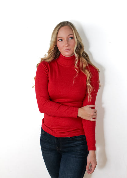 The The Solid Turtleneck Sweater. Available in Red, Black, or Ivory.