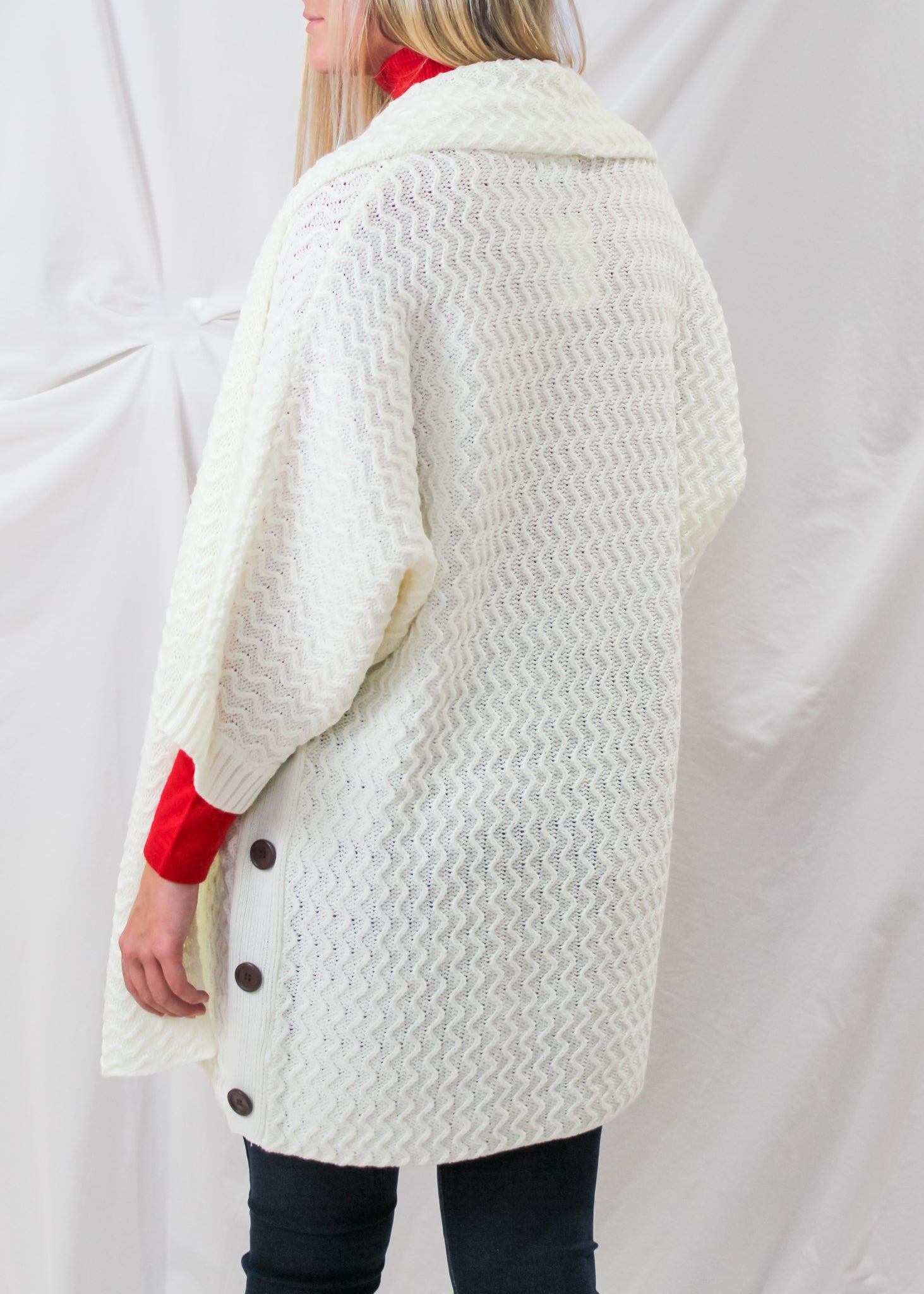 The Knit Cardigan in ivory from the back.