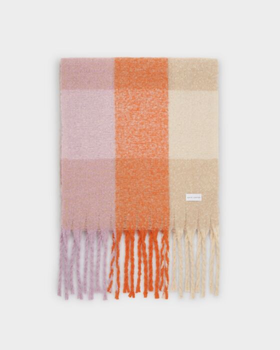 Plaid scarf with fringes in pink, orange, and beige on a white background