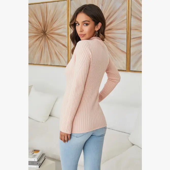 The Rib Mock Neck Sweater in blush color. A back view.