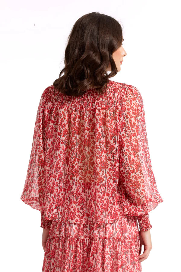 The model is wearing the Cherry Long Sleeves Top. A back view.