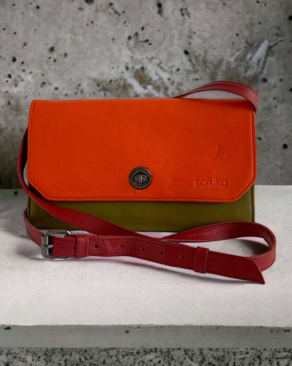 The Soruka Multi-Function Purse. Available at Kadou Boutique with Free Shipping. Showing the green and orange purse. SOR-81085-1