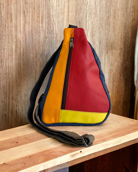 ROXI Sling Bag in navy blue, red, orange and yellow color block. Available at KADOU Boutique.